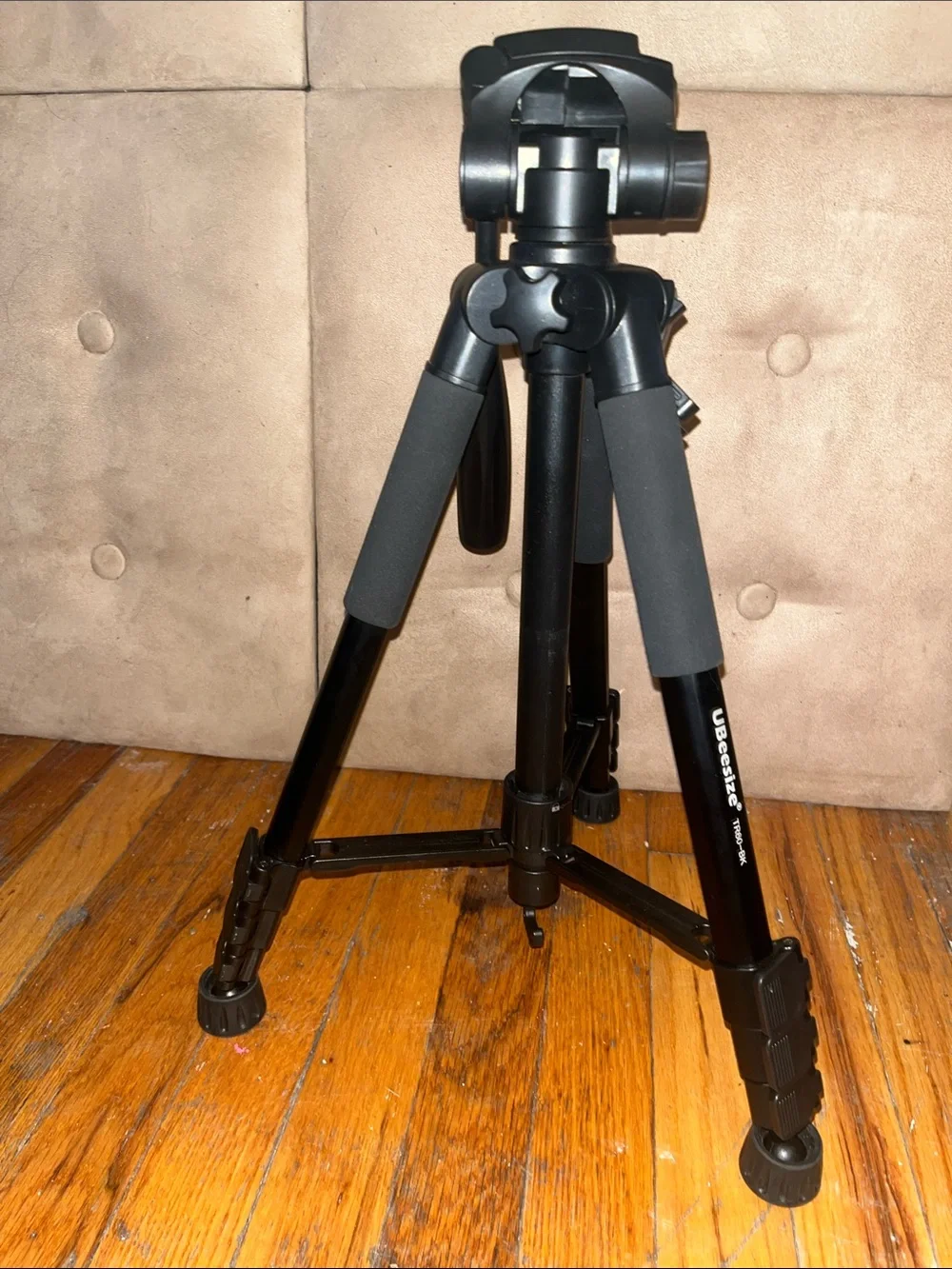 Black Camera Tripod with Foam Grip and Adjustable Head